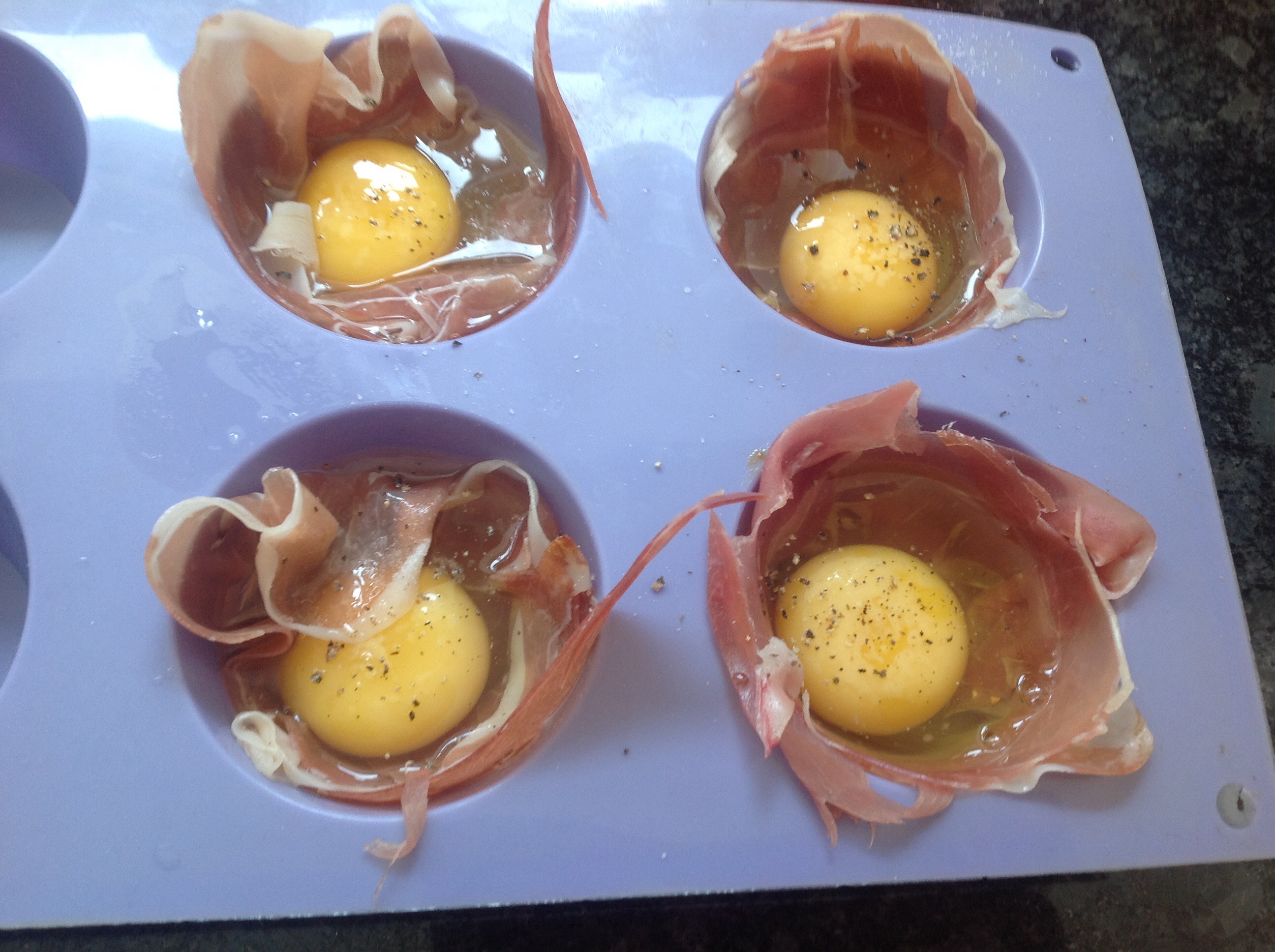 Eggs wrapped in Proscuitto in a silicone muffin case